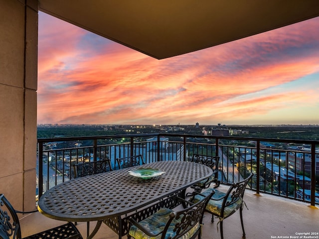 view of balcony at dusk