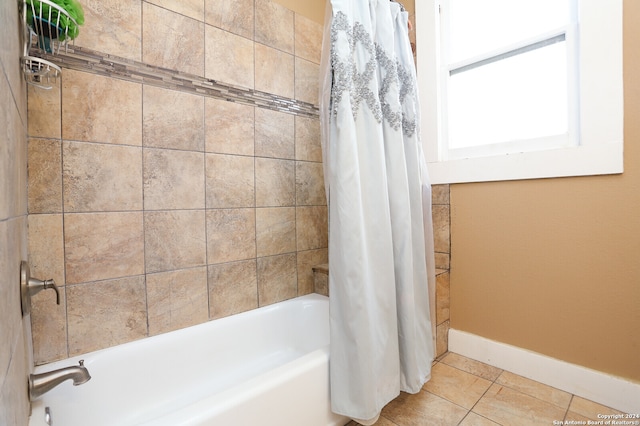 bathroom featuring shower / tub combo with curtain and tile flooring