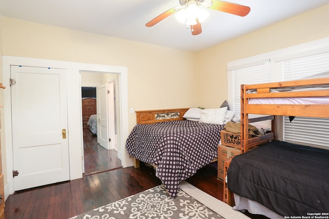 bedroom with ceiling fan and dark hardwood / wood-style floors