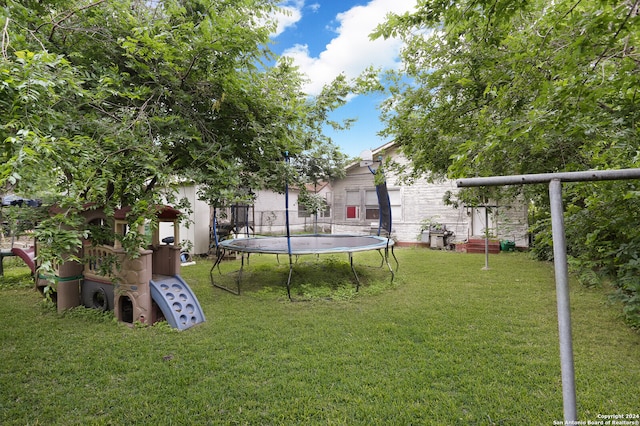 view of yard with a trampoline