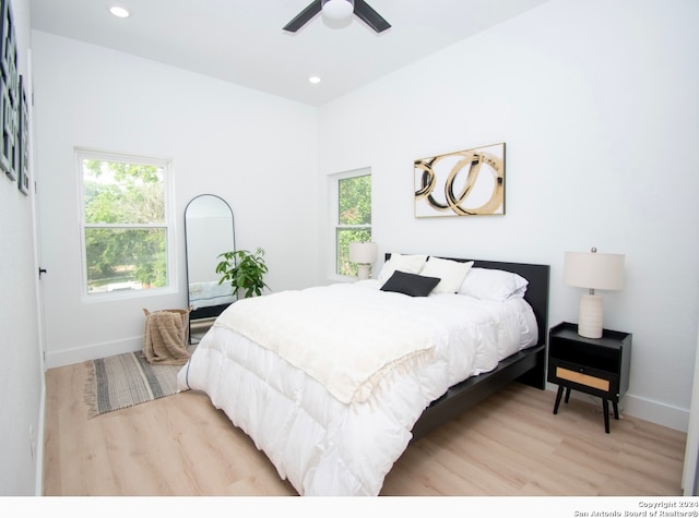 bedroom featuring hardwood / wood-style floors and ceiling fan