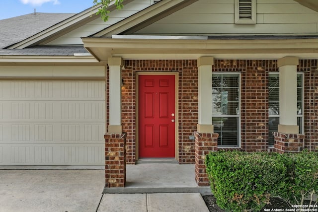 doorway to property featuring a garage