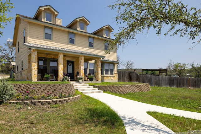 view of front facade featuring a porch and a front lawn