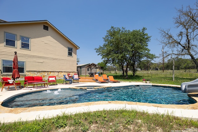 view of swimming pool featuring a gazebo, a patio, pool water feature, and a water slide