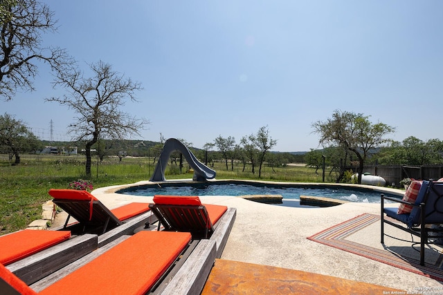 view of swimming pool featuring a water slide