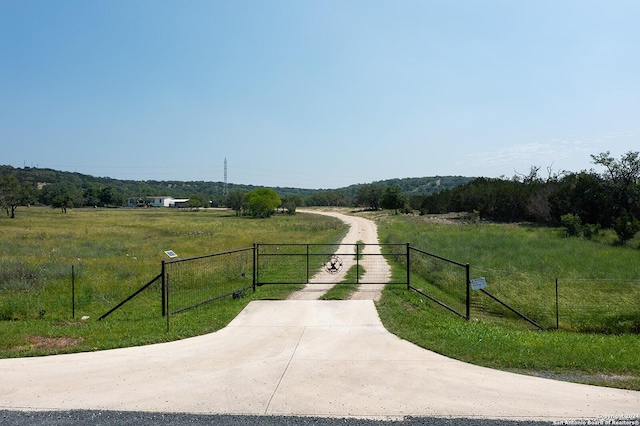 view of gate featuring a rural view