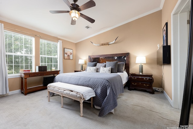 carpeted bedroom featuring ornamental molding, vaulted ceiling, and ceiling fan