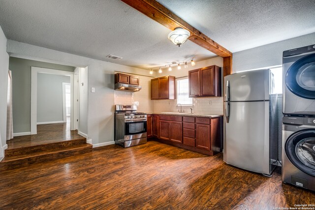 kitchen with appliances with stainless steel finishes, sink, dark wood-type flooring, and beamed ceiling