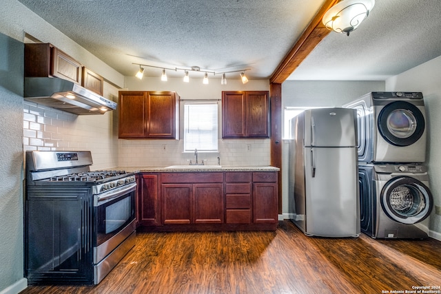 kitchen featuring sink, tasteful backsplash, wall chimney range hood, dark hardwood / wood-style flooring, and stainless steel appliances