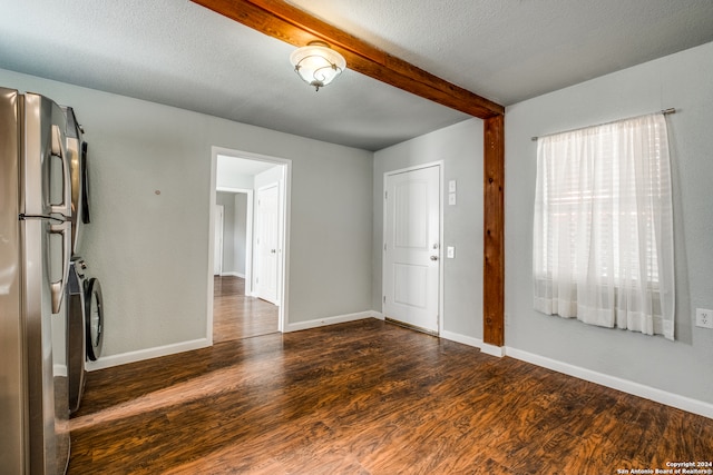 unfurnished room with hardwood / wood-style floors, beamed ceiling, and a textured ceiling