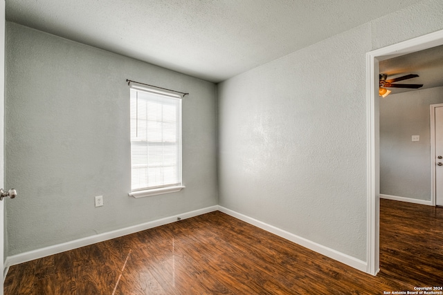 empty room with wood-type flooring, a textured ceiling, and ceiling fan