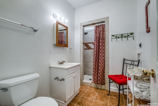 bathroom featuring walk in shower, toilet, tile floors, and vanity