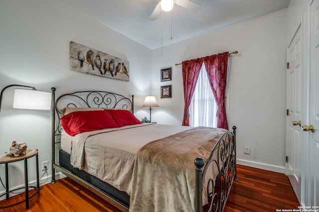 bedroom featuring dark hardwood / wood-style flooring and ceiling fan