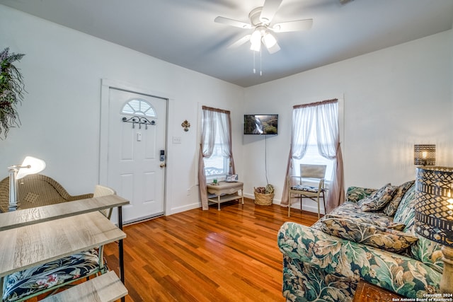 living room with hardwood / wood-style floors and ceiling fan