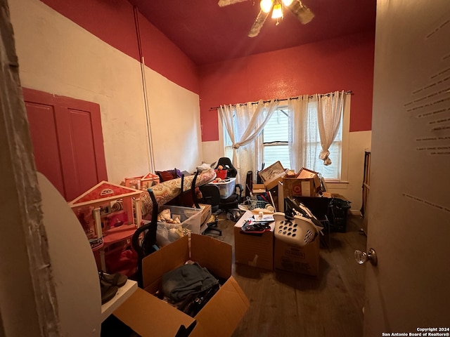 misc room with wood-type flooring and ceiling fan