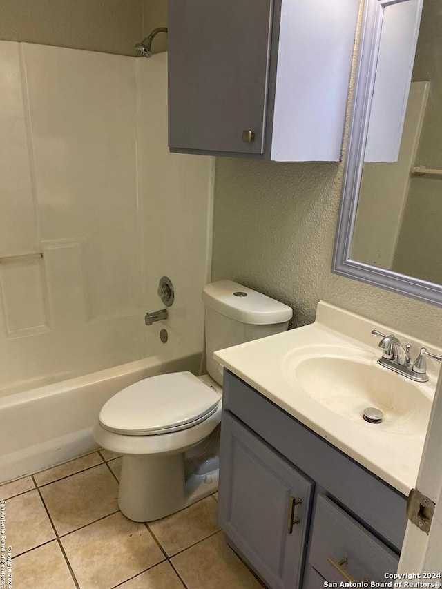 full bathroom with tile flooring, shower / bathing tub combination, vanity, and toilet