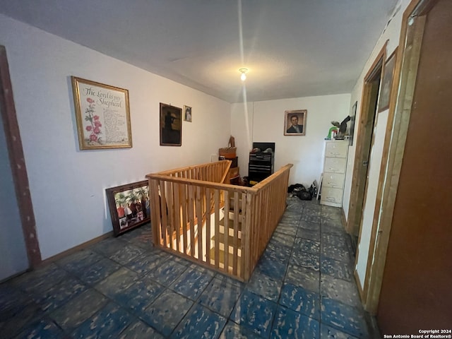 interior space featuring dark tile floors