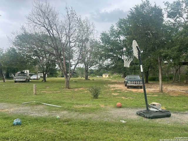 view of home's community with a lawn