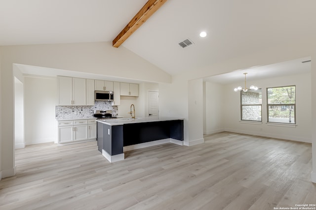 kitchen with light hardwood / wood-style flooring, beamed ceiling, stainless steel appliances, backsplash, and high vaulted ceiling