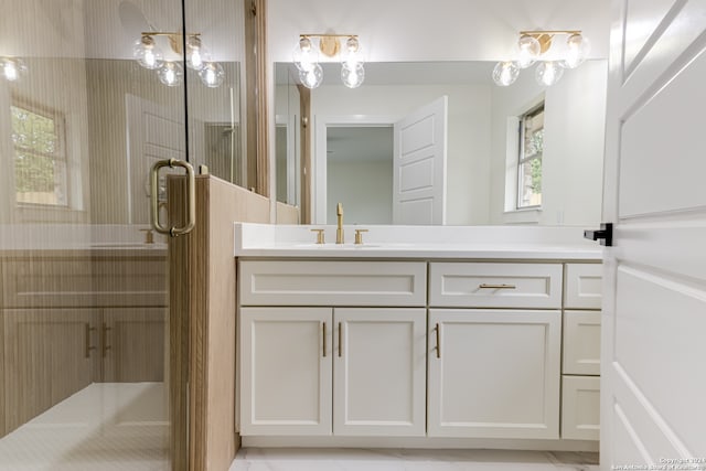 bathroom featuring a chandelier, vanity, and tile floors