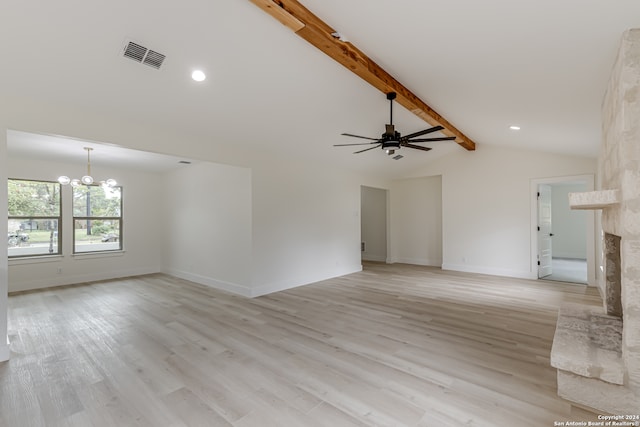 unfurnished living room featuring ceiling fan with notable chandelier, beamed ceiling, light hardwood / wood-style flooring, a premium fireplace, and high vaulted ceiling