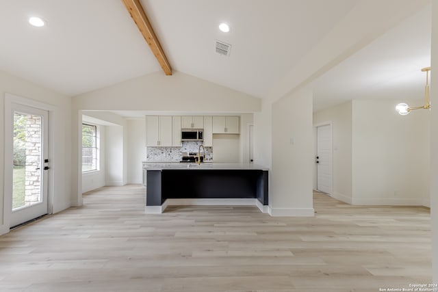 kitchen with light hardwood / wood-style flooring, beamed ceiling, backsplash, pendant lighting, and high vaulted ceiling