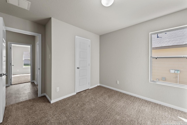 unfurnished bedroom featuring carpet flooring