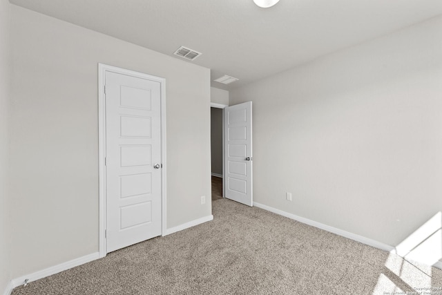 unfurnished bedroom with carpet