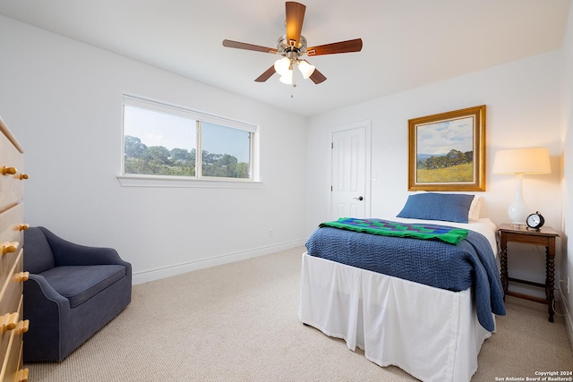 carpeted bedroom featuring ceiling fan