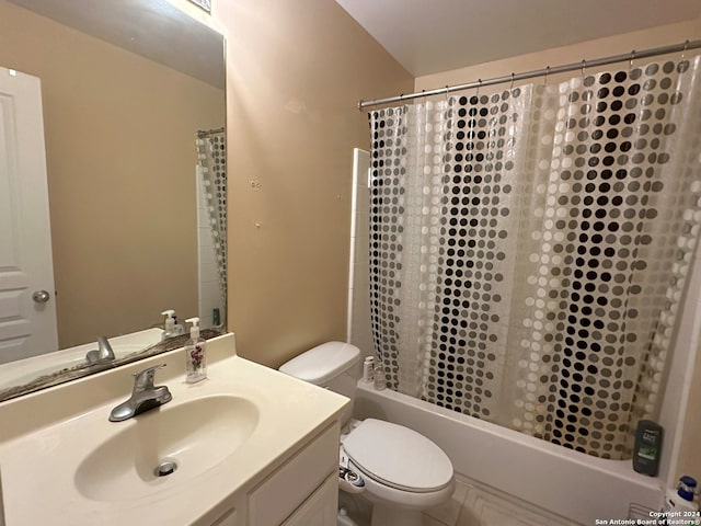 full bathroom with vanity, toilet, and shower / tub combo with curtain