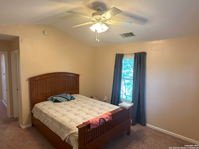 carpeted bedroom featuring lofted ceiling and ceiling fan