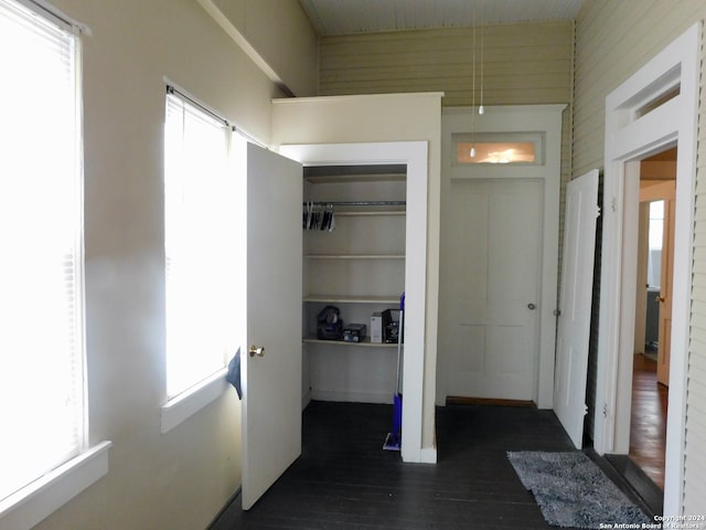 unfurnished bedroom featuring dark hardwood / wood-style floors and a closet