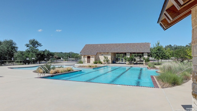 view of swimming pool featuring a patio