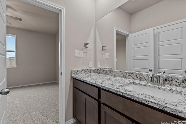 bathroom featuring vanity and ceiling fan