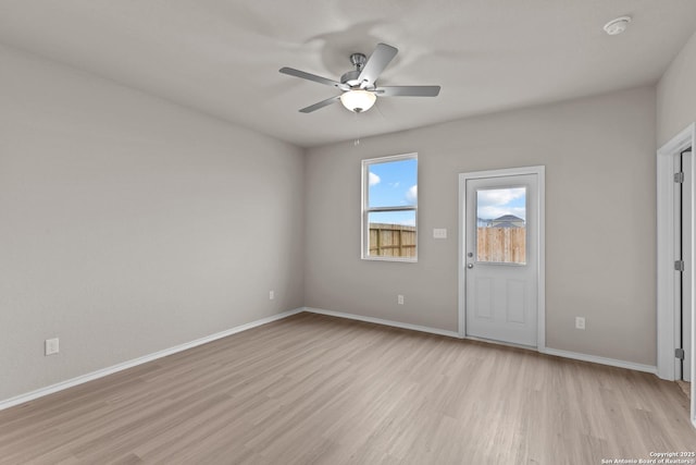 unfurnished room featuring light wood-type flooring and ceiling fan