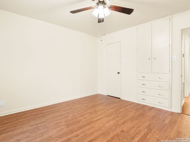 unfurnished bedroom with light hardwood / wood-style floors and ceiling fan