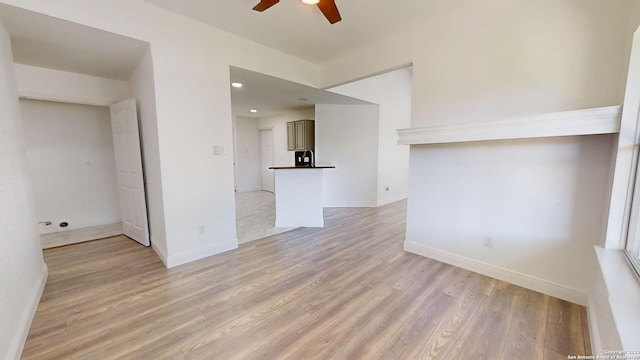 spare room with wood-type flooring and ceiling fan