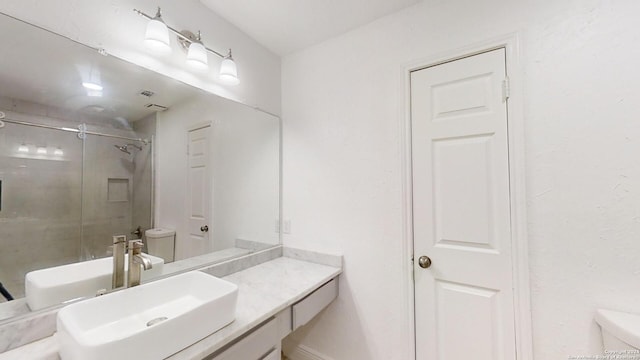 bathroom with toilet and vanity