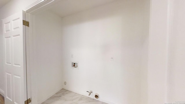 clothes washing area featuring hookup for a gas dryer, washer hookup, and light tile flooring