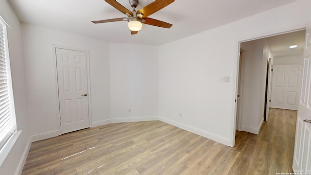 unfurnished room featuring wood-type flooring and ceiling fan