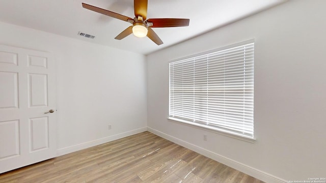 spare room with ceiling fan and light hardwood / wood-style flooring