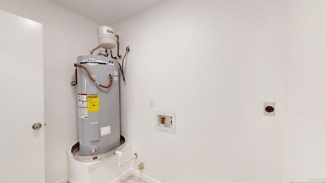 utility room featuring electric water heater