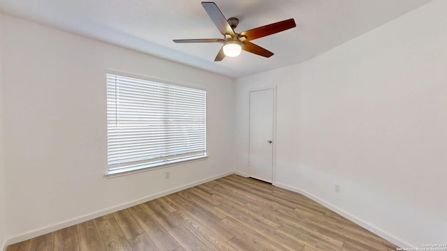 empty room with light hardwood / wood-style floors and ceiling fan