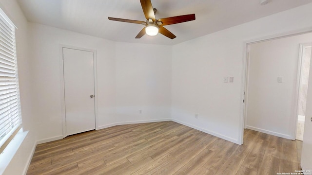 spare room with ceiling fan and light hardwood / wood-style floors