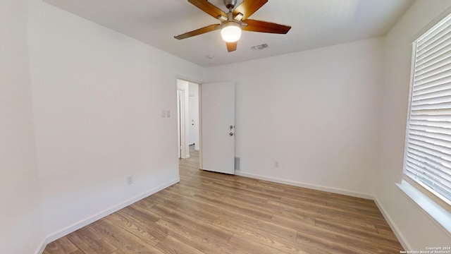 unfurnished room featuring ceiling fan and light wood-type flooring