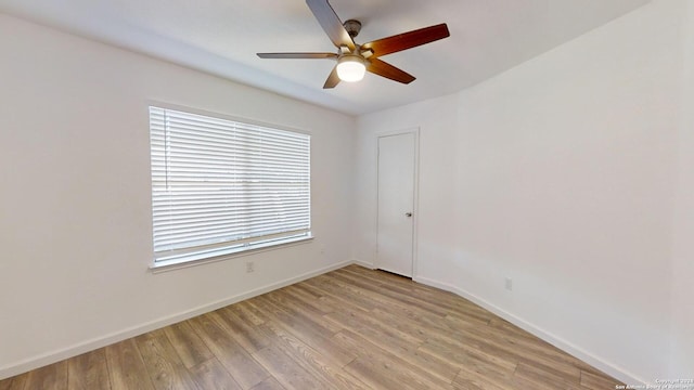 spare room featuring ceiling fan and light hardwood / wood-style flooring