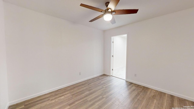 empty room featuring hardwood / wood-style floors and ceiling fan