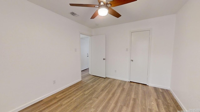 spare room with ceiling fan and light hardwood / wood-style flooring