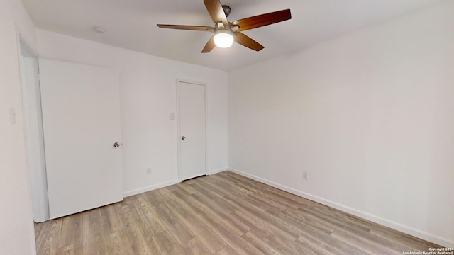 unfurnished room with light hardwood / wood-style floors and ceiling fan