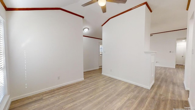 spare room with ornamental molding, lofted ceiling, ceiling fan, and light hardwood / wood-style flooring